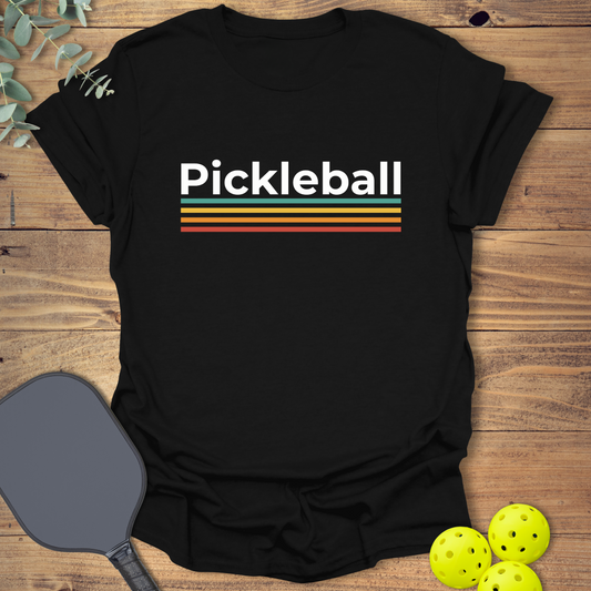 Colorful pickleball t-shirt with a retro-style design in black
