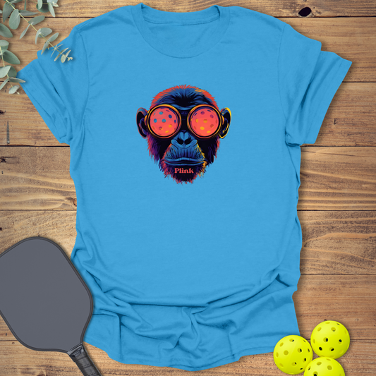 Cool pickleball t-shirt with a cyberpunk design featuring Neospin the chimp in iris blue