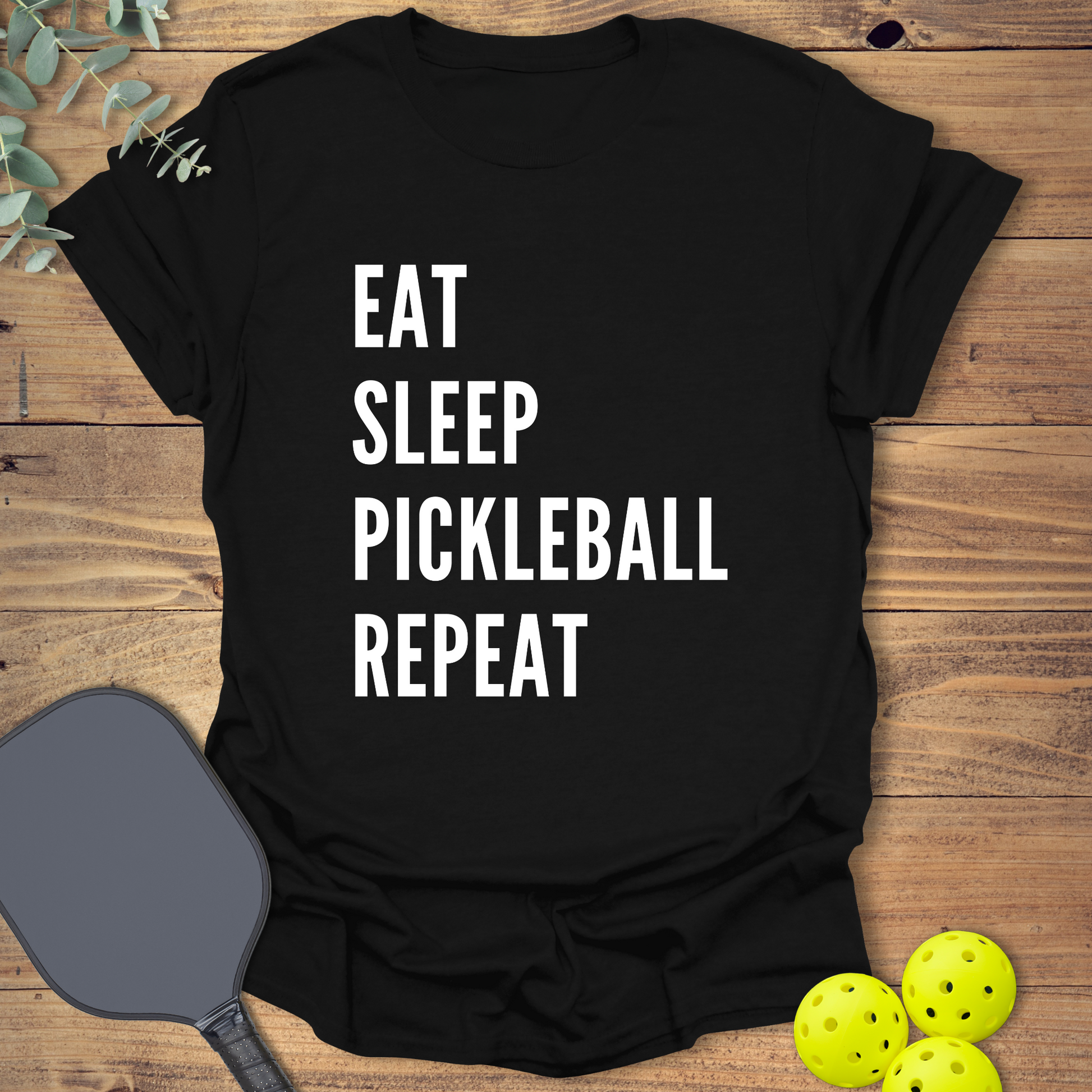 Funny pickleball t-shirt with a pickleball slogan in black