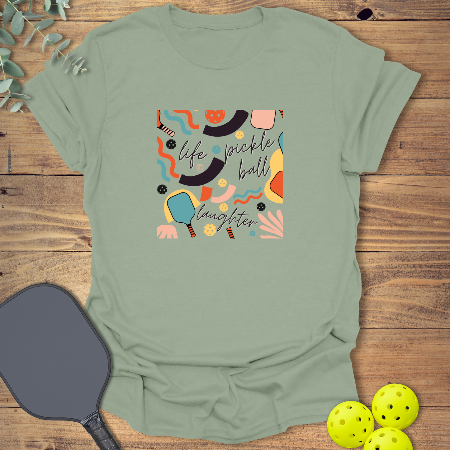 fun pickleball t-shirt with a retro-style design in sage green