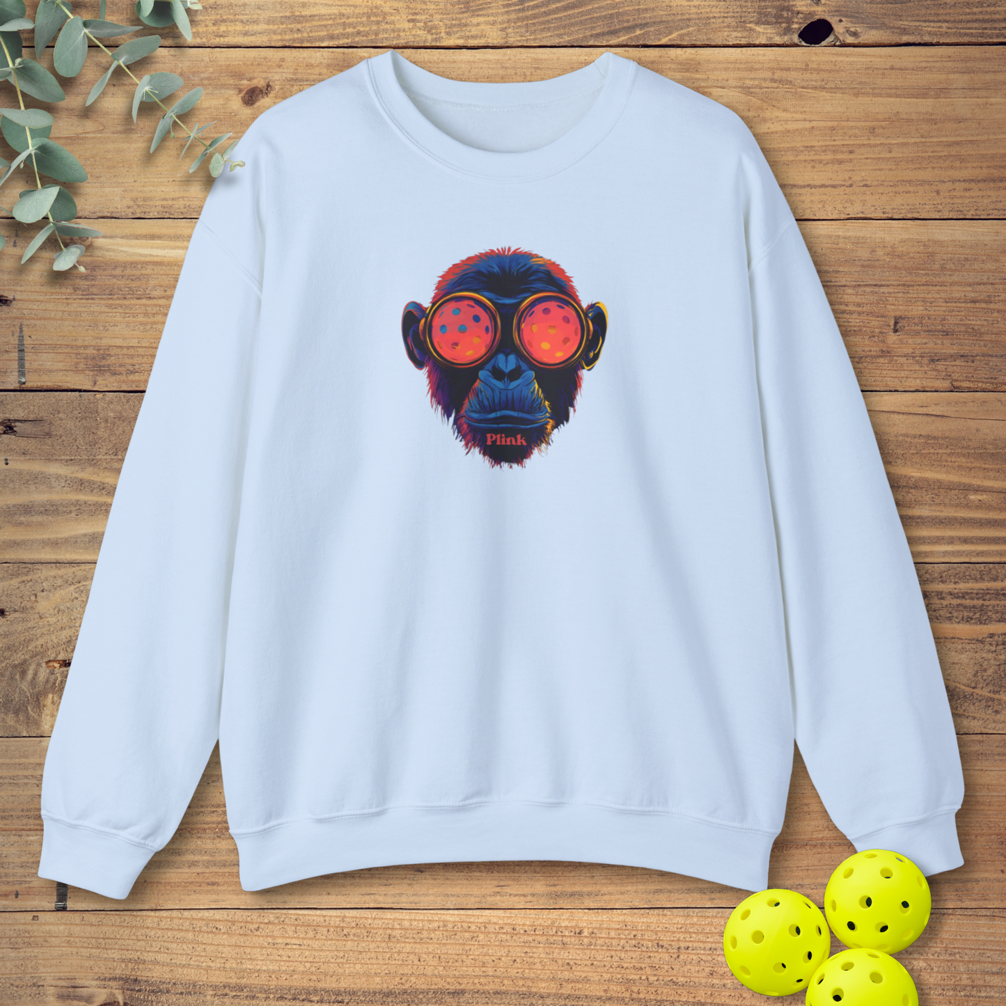 pickleball sweatshirt with a chimpanzee face in light blue