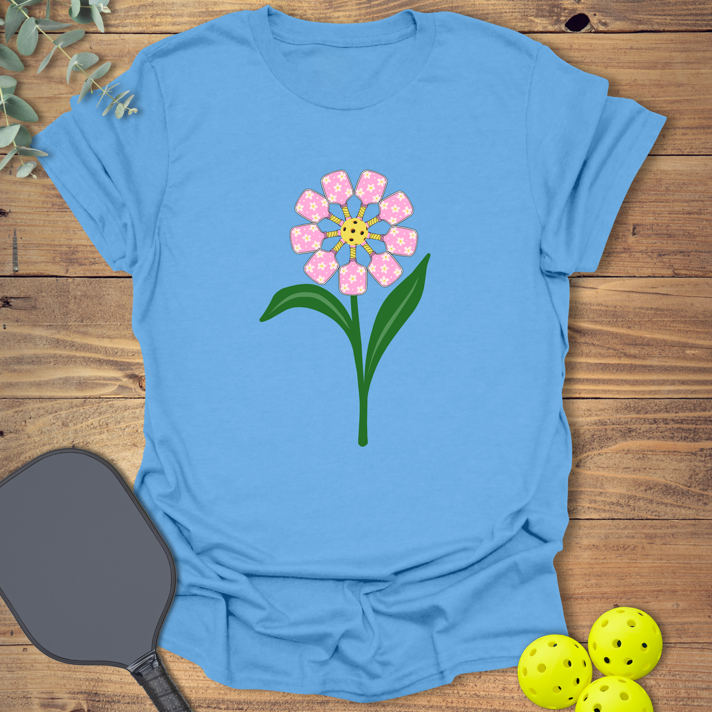 Fun pickleball t-shirt with a bright flower design in blue