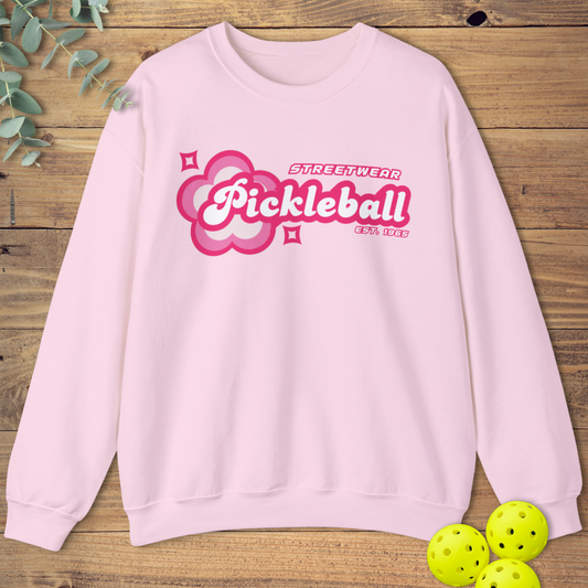 graphic pickleball sweatshirt with a retro-style design in light pink