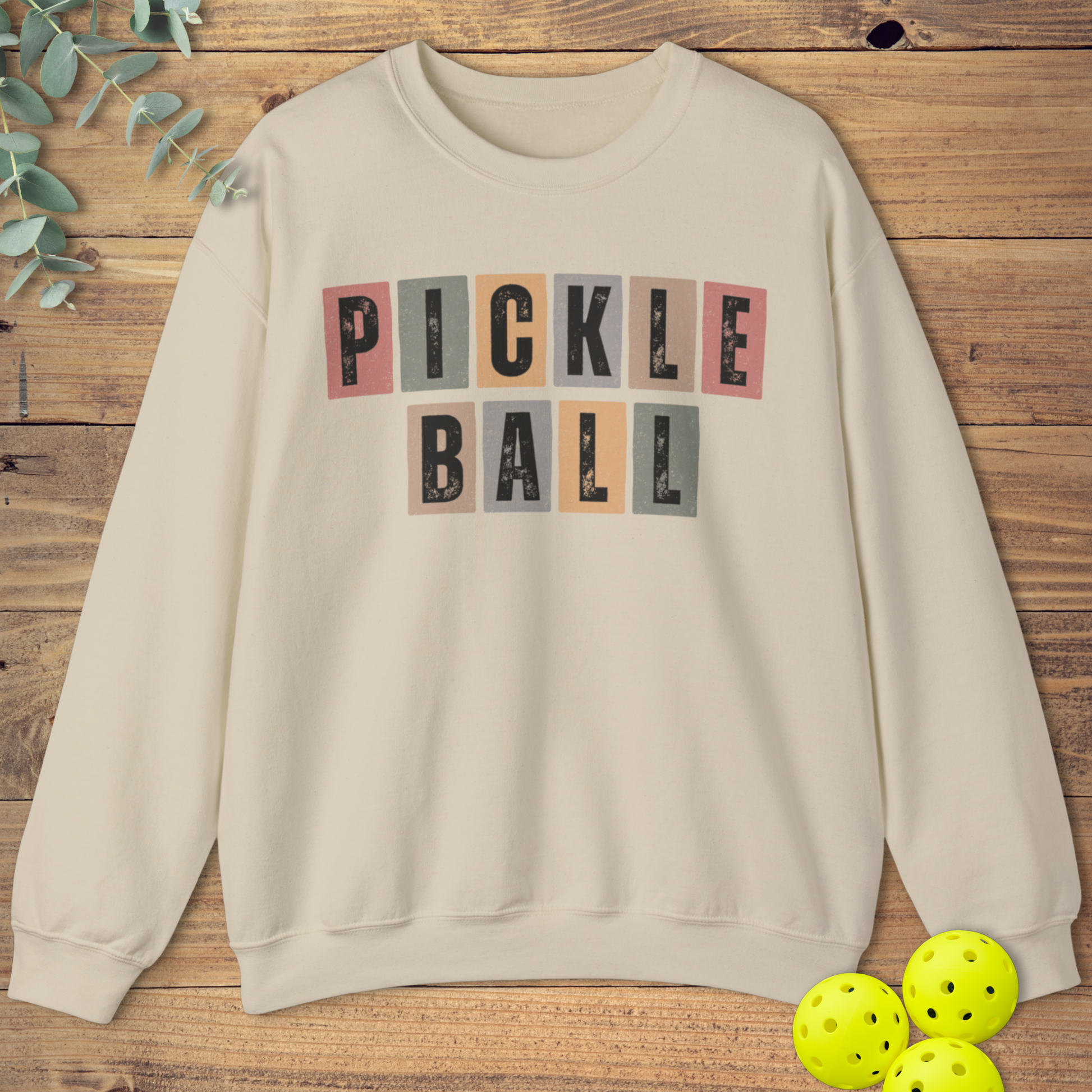 Graphic pickleball sweatshirt with a vintage-style design in beige