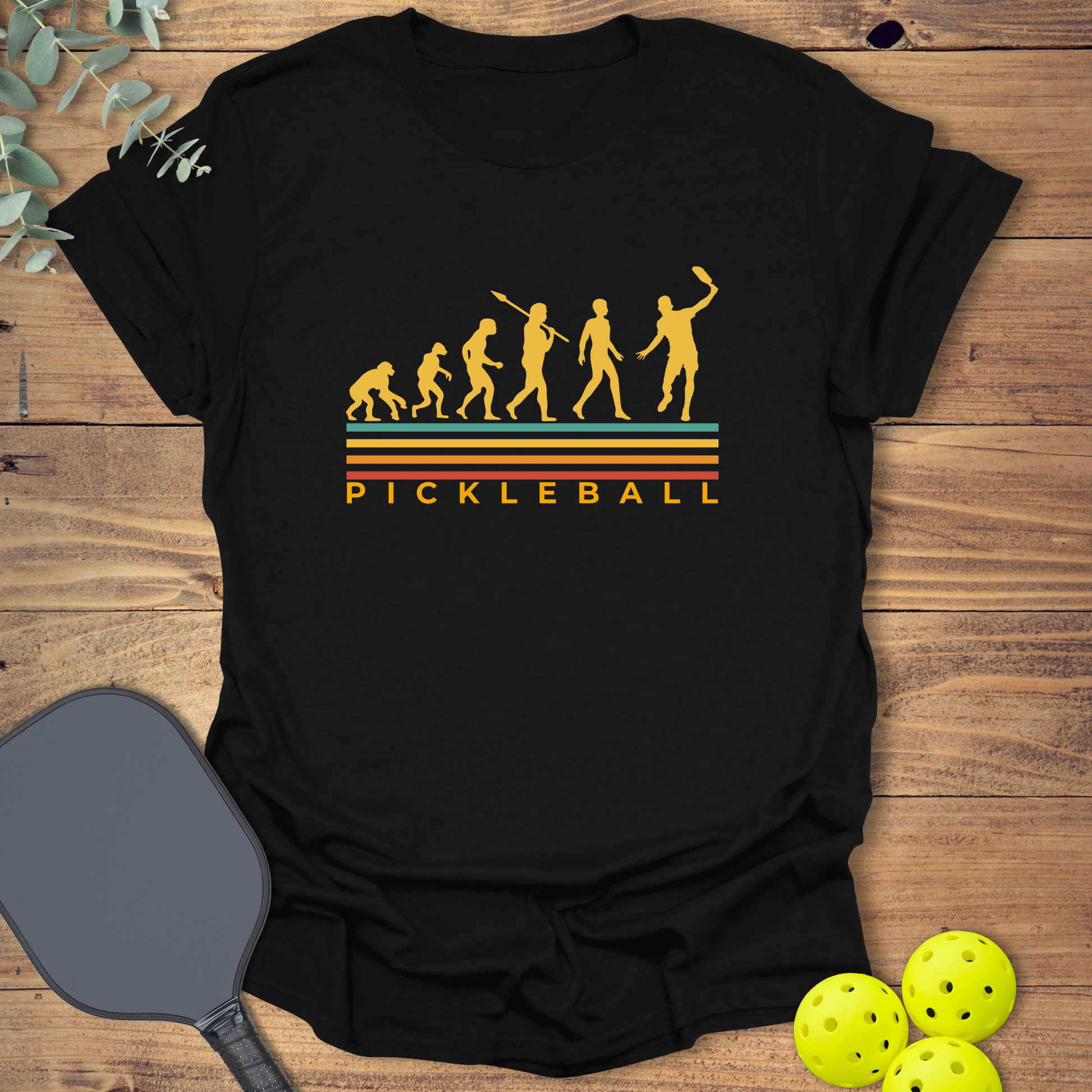 funny pickleball t-shirt with a retro-style design featuring evolution in black