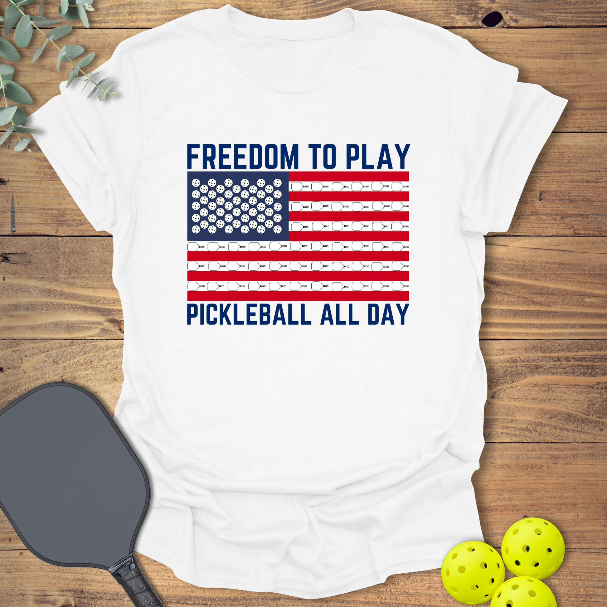 Patriotic pickleball t-shirt with an American flag on white