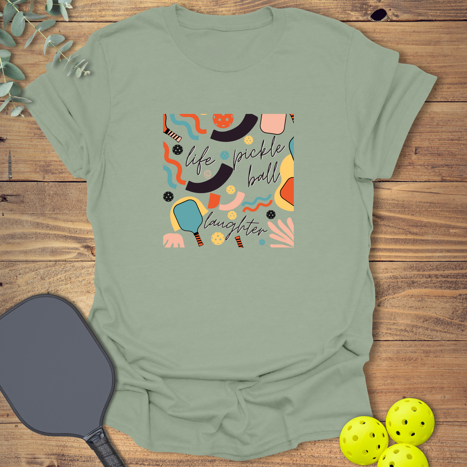 fun pickleball t-shirt with a retro-style design in sage green