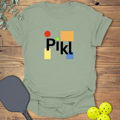 Graphic pickleball t-shirt with a geometric design in sage green